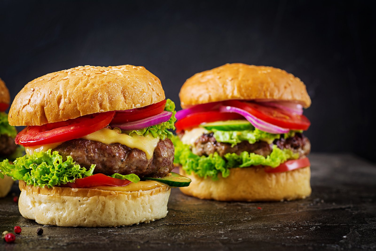 hamburger-with-beef-meat-burger-and-fresh-vegetables-on-dark-surface.jpg